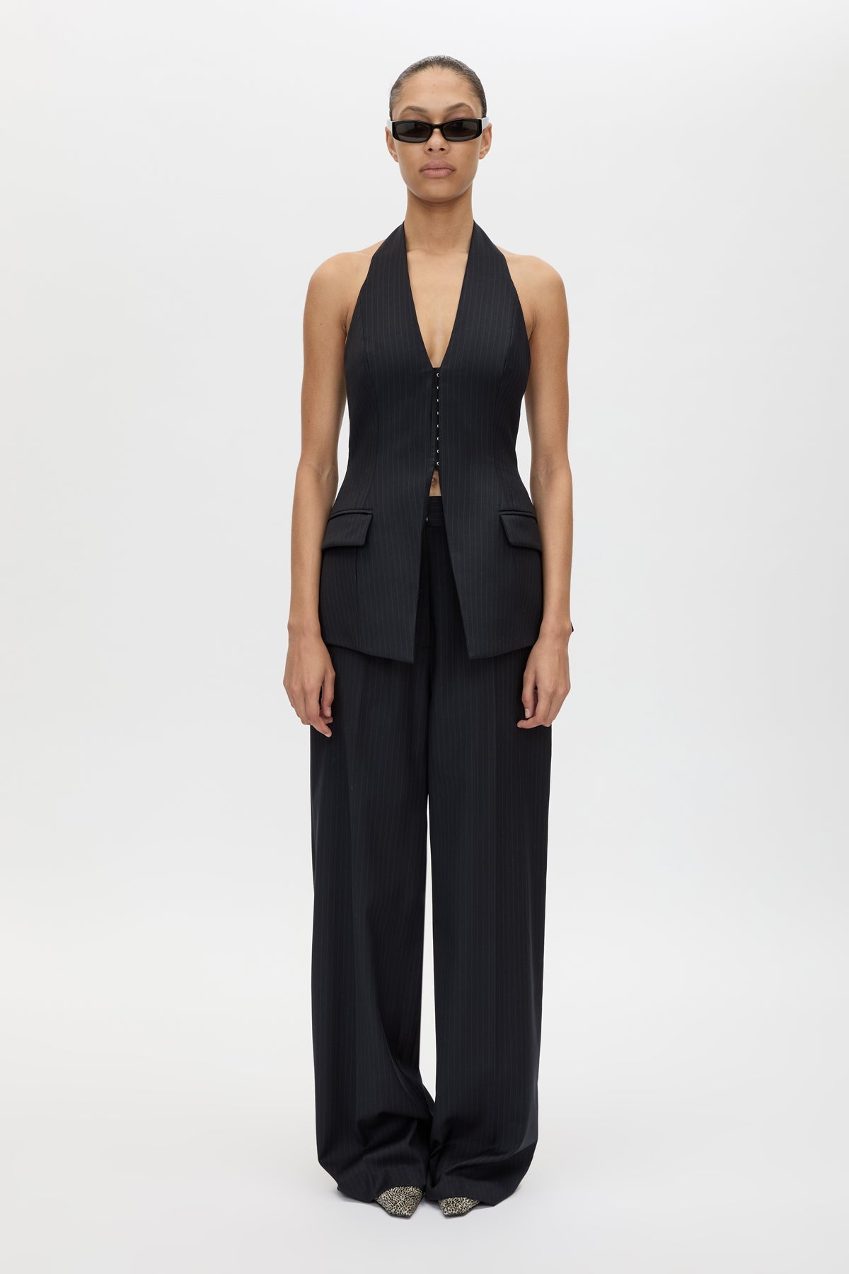 Front view CAMILLA AND MARC Orban Tailored Halter Top in Navy Pinstripe with deep V‑neck, fitted waist and open back.