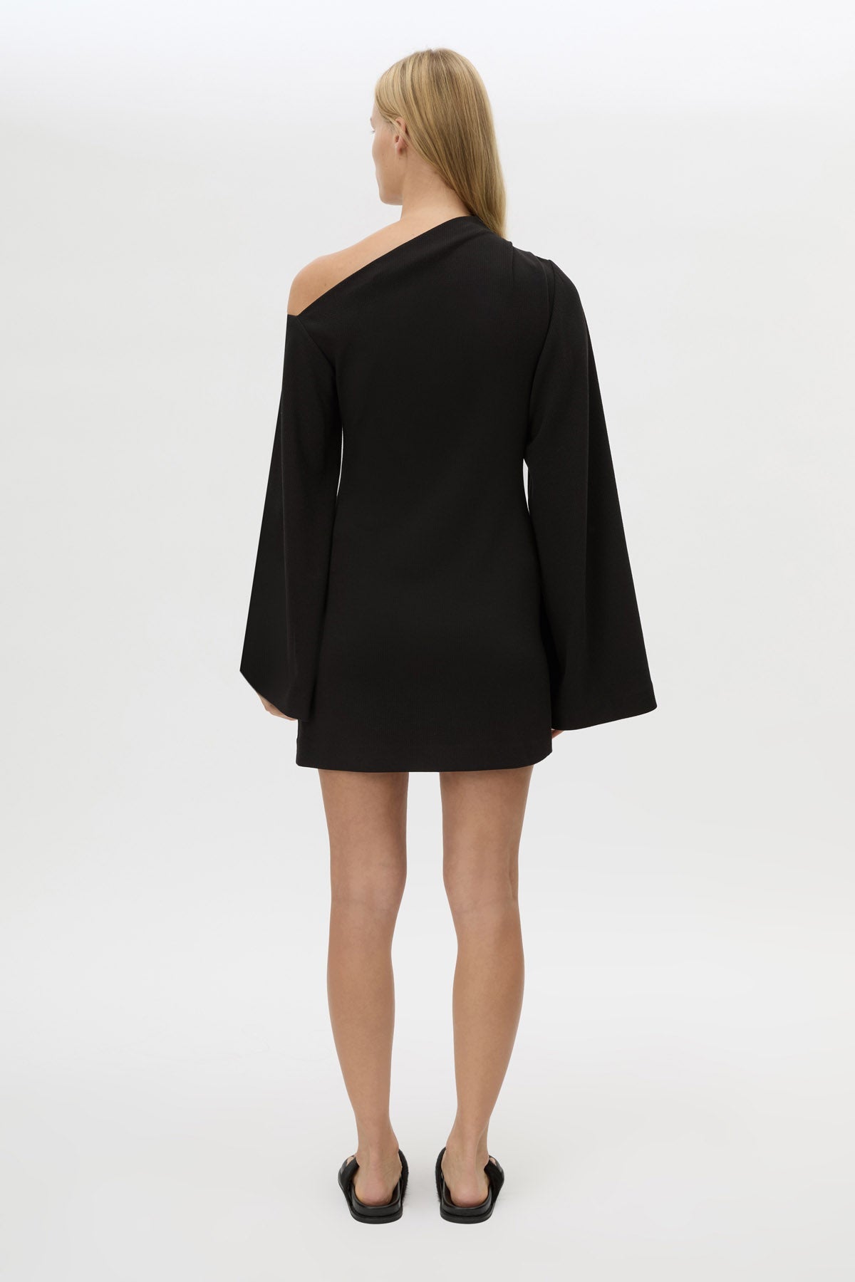 Back view CAMILLA AND MARC Serenitas Mini Dress in Black with off the shoulder long-sleeves.