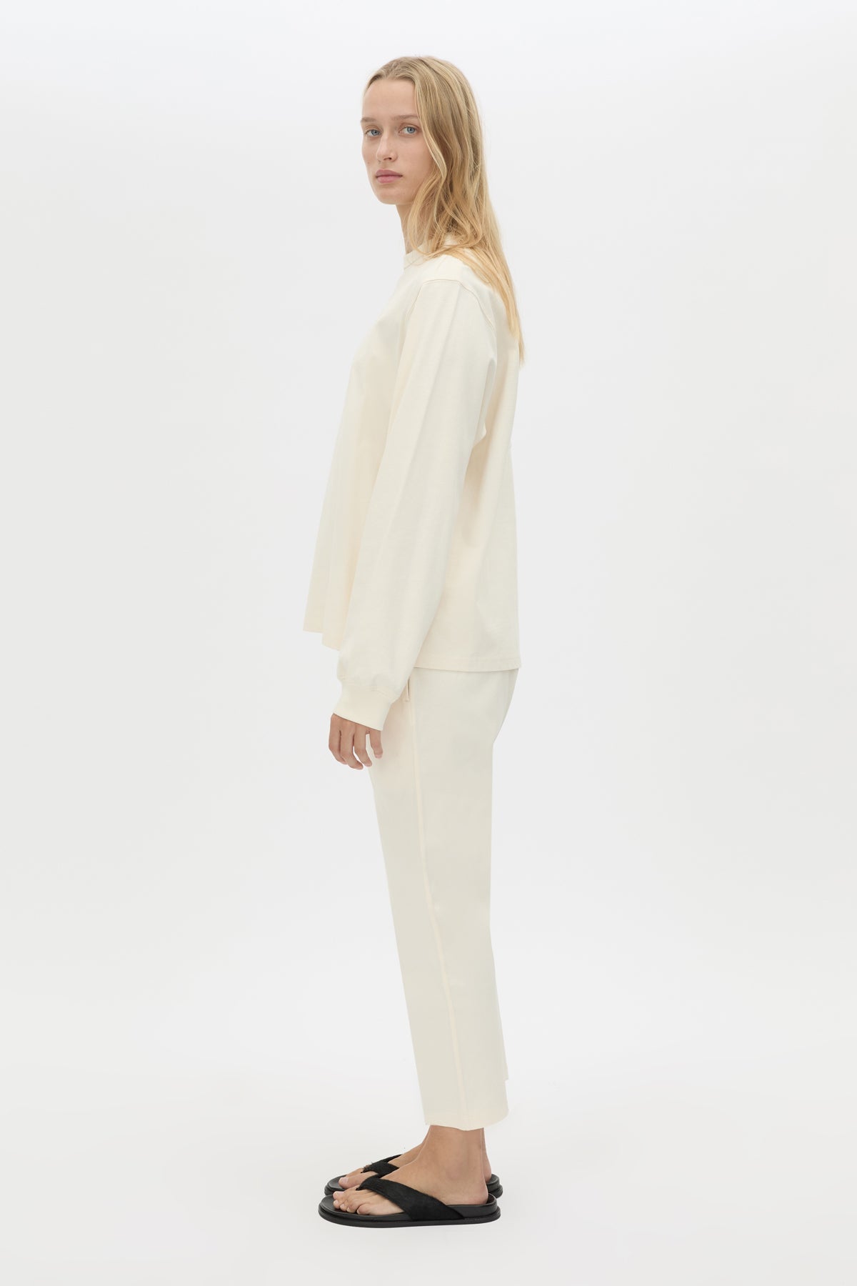 Side view CAMILLA AND MARC Studio cropped mid-rise track pant in winter white with elasticated waistband. 