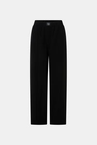 Ghost view CAMILLA AND MARC Sylvia soft suiting high-waisted pant in black with monogram patch at waistband.