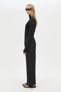 Side view CAMILLA AND MARC Sylvia soft suiting high-waisted pant in black with monogram patch at waistband.