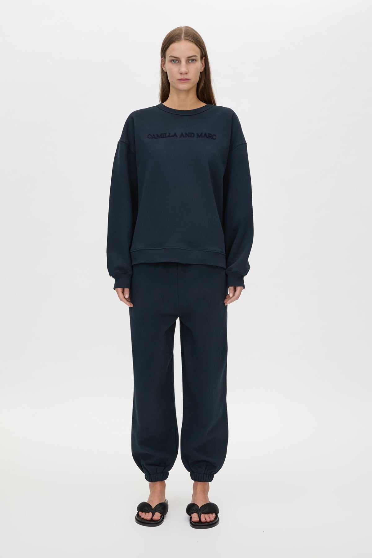 Front styled view CAMILLA AND MARC Tia Flocking Logo Crew in Deep Ink with relaxed fit, logo artwork and 100% cotton.
