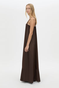 Side view CAMILLA AND MARC Tove Maxi Dress in Chocolate with a sleeveless silhouette and contrasting satin trim. 