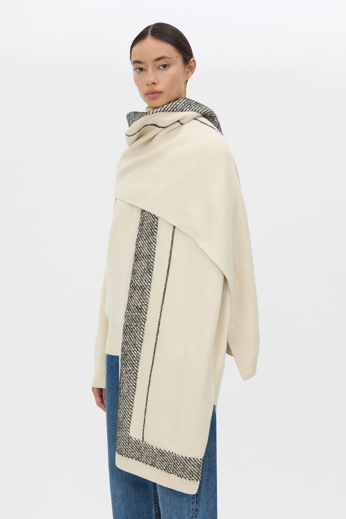 Cropped view CAMILLA AND MARC Tusk Knit Stripe Scarf in Black with striped jacquard graphic and Australian wool fabrication.