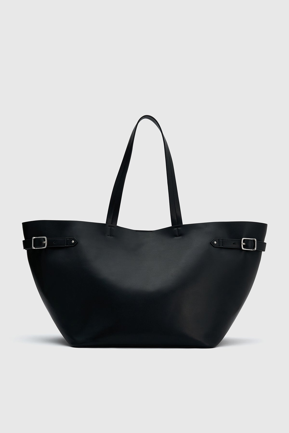 Front view CAMILLA AND MARC Willa Tote in Black with side strap and buckle detailing and magnetic button closure.