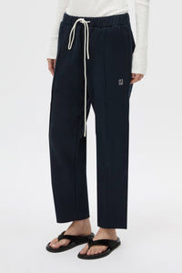 Cropped view CAMILLA AND MARC Zylus straight-leg tracksuit pant in navy with embroidered monogram.