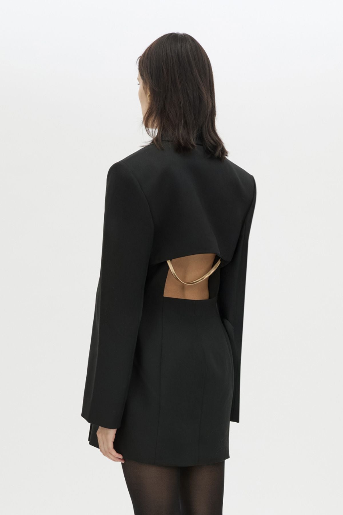 Back view CAMILLA AND MARC Cassie long sleeve mini dress in black with open back removable chain detail.