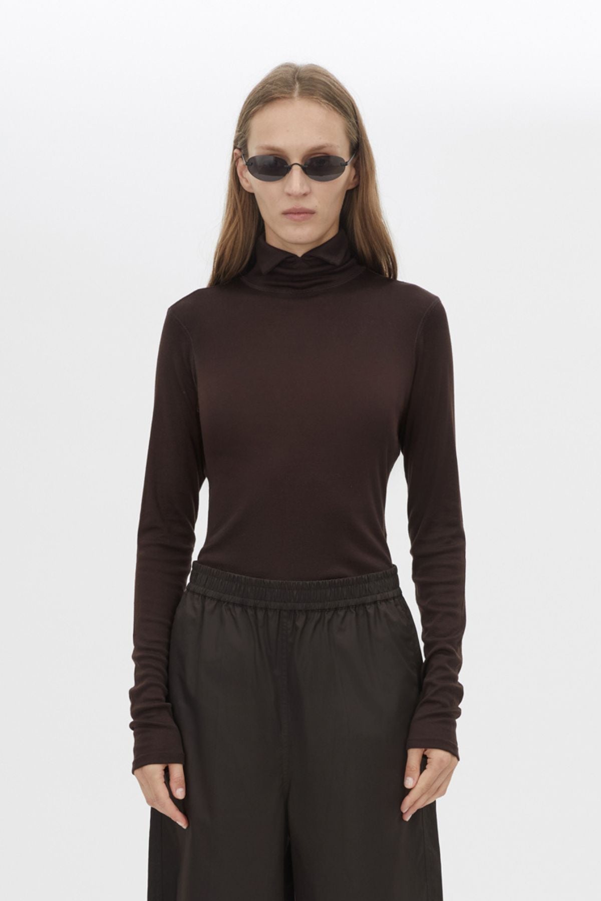 Cropped view CAMILLA AND MARC Barre High Neck Top in Chocolate with long sleeves and turtleneck silhouette.  