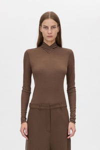 Cropped view CAMILLA AND MARC Axial Top in Chocolate with layered cross‑over high neck.